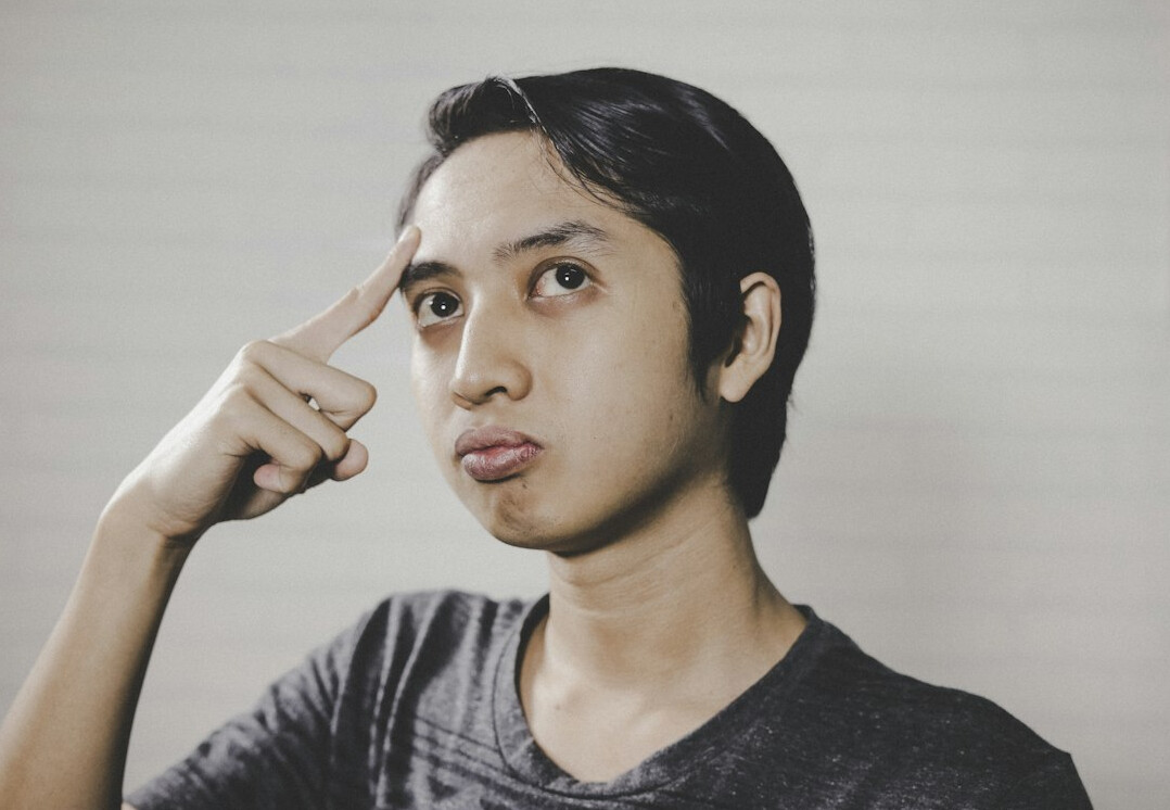 Studio portrait of a young Belgian male sector analyst